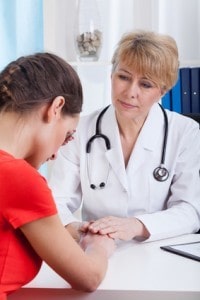 Doctor comforting a young patient